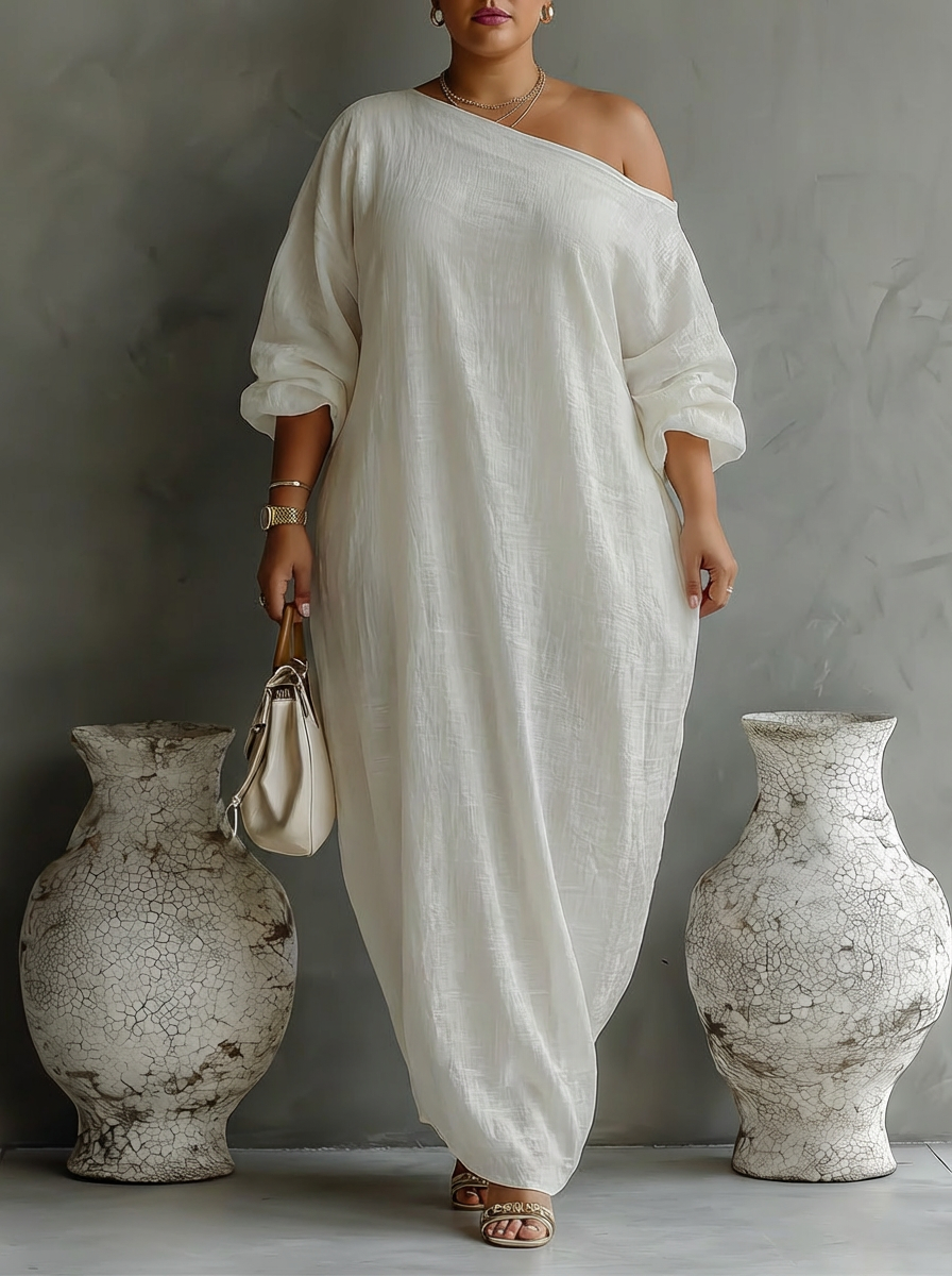 Elegant Flödande Klänning i Elfenben Vitt med Off-Shoulder