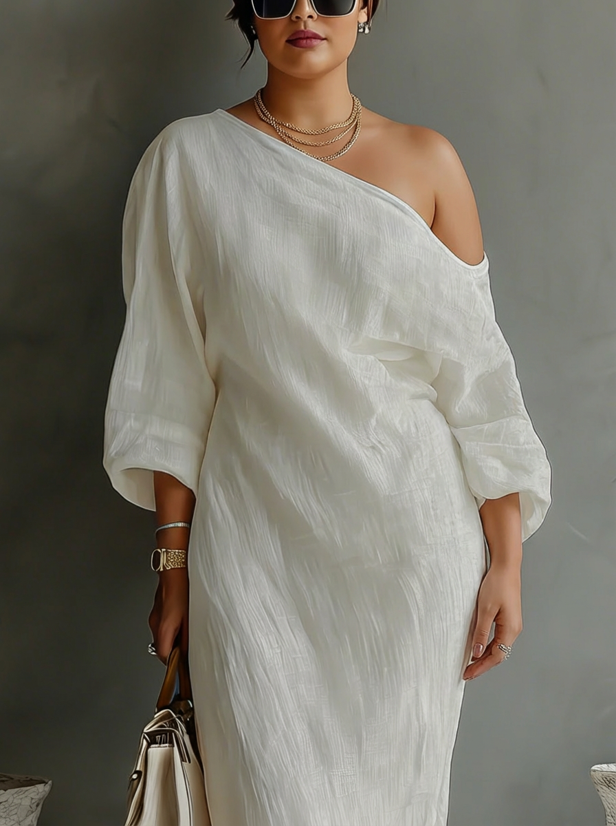 Elegant Flödande Klänning i Elfenben Vitt med Off-Shoulder