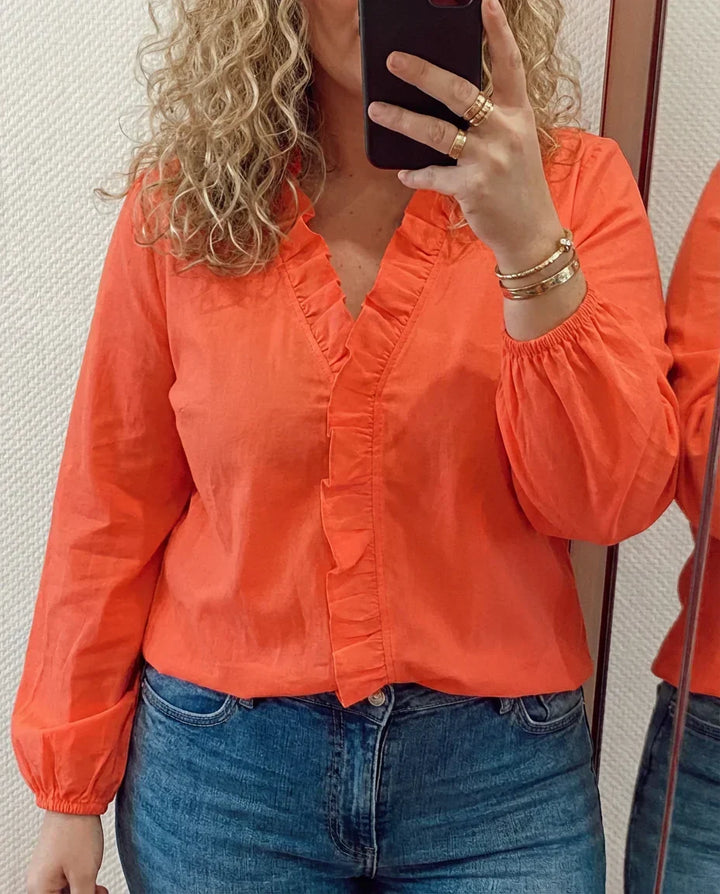 Magnolia | Feminin Blus med Lekfulla Volanger