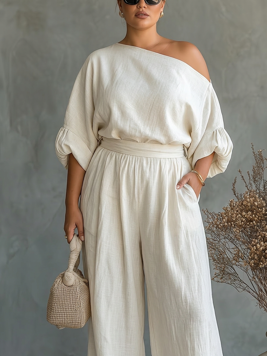 Kvinnors Off-White Set med Off-Shoulder Topp och Taperade Byxor